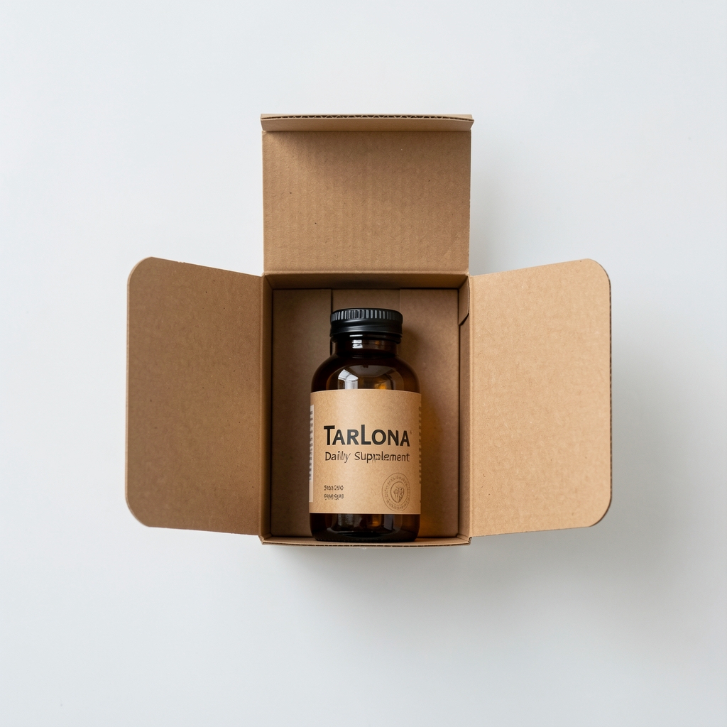 Flat-lay of Drevani daily supplement box packaging opened to show amber glass bottle inside kraft paper insert, minimal product presentation on white surface